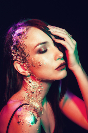 Portrait of a girl on a black backgroundの写真素材