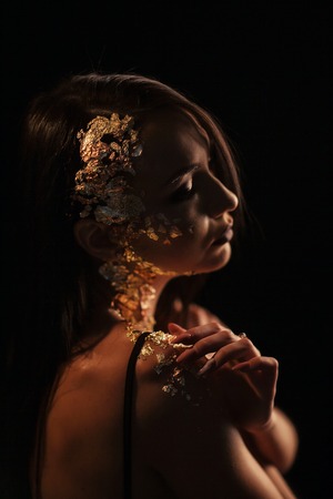 Portrait of a girl on a black backgroundの写真素材
