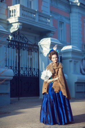 Beautiful caucasian girl dressed in the style of the Renaissance. Photo in blue tonesのeditorial素材