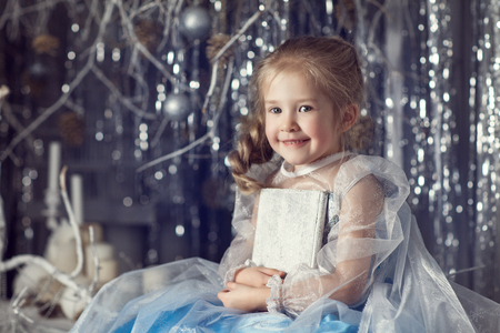 Girl with a white bookの写真素材