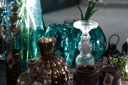Glass cups and vases in the store. They shine in the sunの写真素材