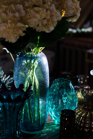Glass cups and vases in the store. They shine in the sunの写真素材