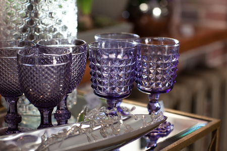 Glass cups and vases in the store. They shine in the sunの写真素材