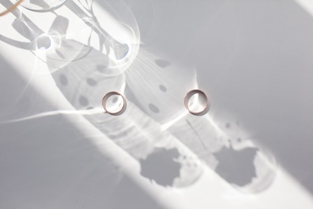 Golden wedding rings on a light background. Holiday concept