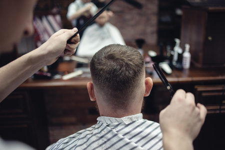 hair cutting head scissors. Barber's work. Men's hairdresserの写真素材