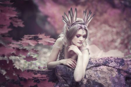 Fairytale girl in beautiful stones. Stones in the moss.の写真素材