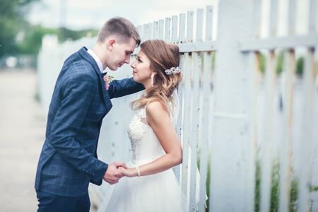 Newlyweds near the iron fence. Linear perspectiveの写真素材