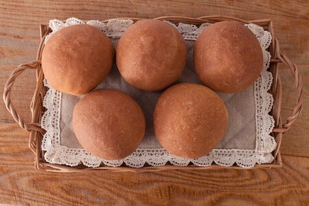 Fresh mouth-watering buns. Several delicious round bunsの写真素材