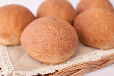 Fresh mouth-watering buns. Several delicious round bunsの写真素材