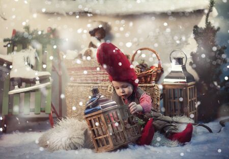 Little christmas gnome in a red cap and vest.の写真素材