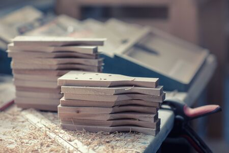 Wooden blanks. Factory, wood products. Workshop for the manufacture of wooden products. Balalaika makingの写真素材