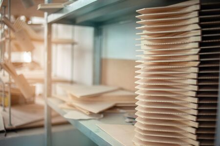 Wooden blanks. Factory, wood products. Workshop for the manufacture of wooden products. Balalaika makingの写真素材