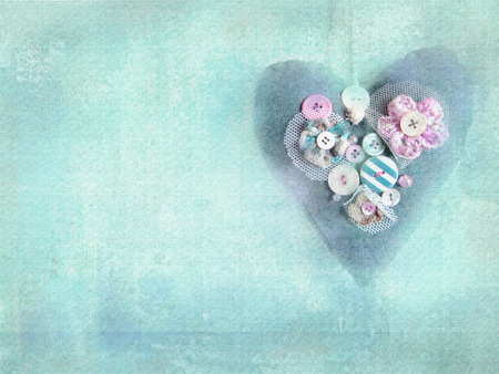 Handmade textile heart creative embellished colorful flower and buttons on grunge turquoise...