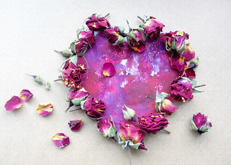 Rose petals in heart shape. Valentine greeting or wedding composition.の写真素材