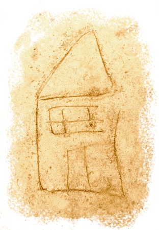 Drawing on sea sand. House drawn on wet sand. A beach house.の写真素材