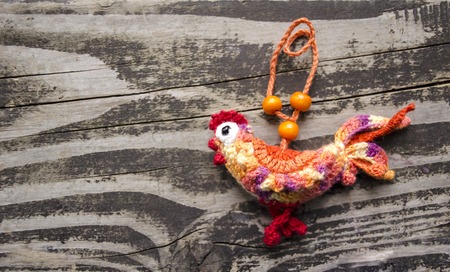 New year 2017 symbol - handmade rooster on a wooden backgroundの写真素材