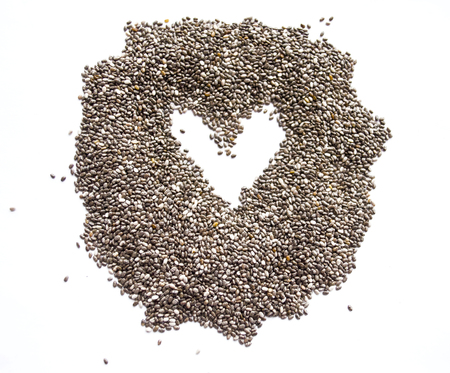 Organic dry chia seeds isolated on a white background. Nutritious chia seeds background. Top view on chia seeds.の写真素材