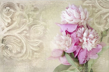 Architectural details. Antique wall in grunge style with meander, capitals, friezes. Art deco figures carved on stone as decoration on a facade building. Fragment of ornate relief with peony flowers.の写真素材