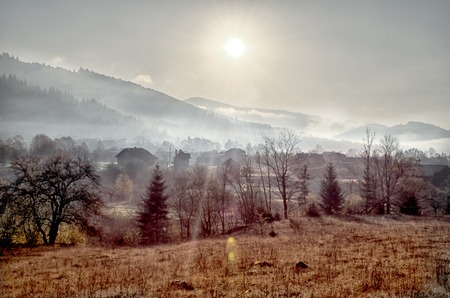 Carpathian mountains in the autumn with a wooden house. Colorful autumn landscape scene.の写真素材