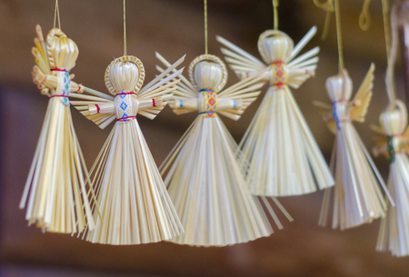 Traditional handmade straw doll gift. Decorative angel figure.の写真素材