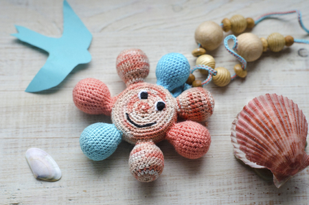 Necklace made from knitted beads for the baby sitting in a sling. Knitted beads. Sling necklace.の写真素材