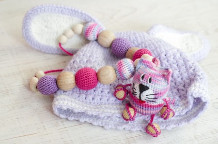 Knitted pink striped handmade crafted cat. Children's toy. Crochet pattern. Handicraft...
