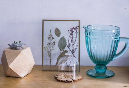 ,Colorate Echeveria in a wooden planter on a wooden table. Photo succulent decor in Hoogge styleの写真素材