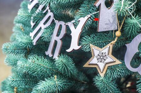 Merry Christmas and Happy New Year festive card. Christmas fir tree decoration . Holiday composition. Festive background.の写真素材