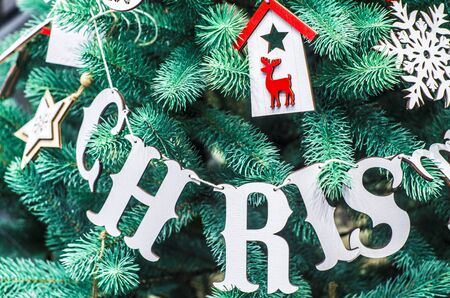 Merry Christmas and Happy New Year festive card. Christmas fir tree decoration . Holiday composition. Festive background.の写真素材