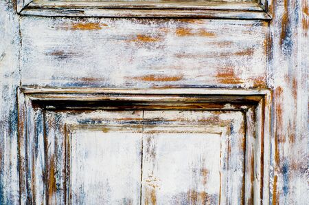 Vintage wooden background with faded peeling white paint. Old wooden painted texture surface. Shabby Planks with cracked color paint.の写真素材