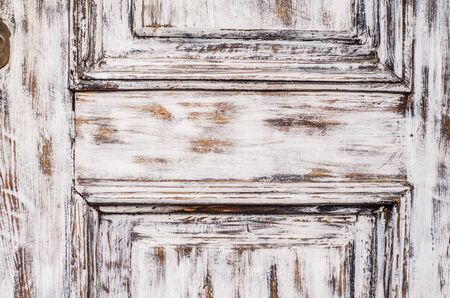 Vintage wooden background with faded peeling white paint. Old wooden painted texture surface. Shabby Planks with cracked color paint.の写真素材