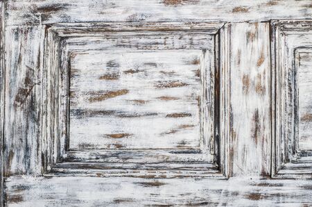 Vintage wooden background with faded peeling white paint. Old wooden painted texture surface. Shabby Planks with cracked color paint.の写真素材