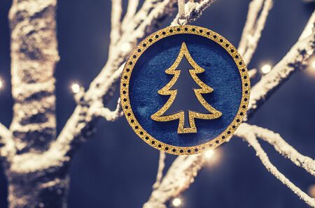 Merry Christmas and Happy New Year festive card. Christmas fir tree decoration . Holiday composition. Festive background.の写真素材