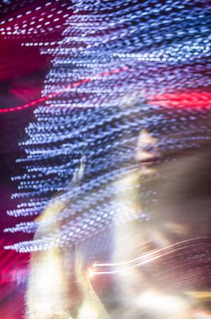 Blurred photo of neon lights. Abstract background.の写真素材
