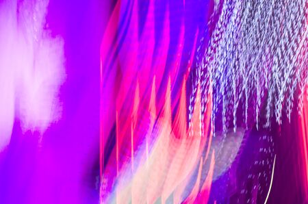 Blurred photo of neon lights. Abstract background.の写真素材
