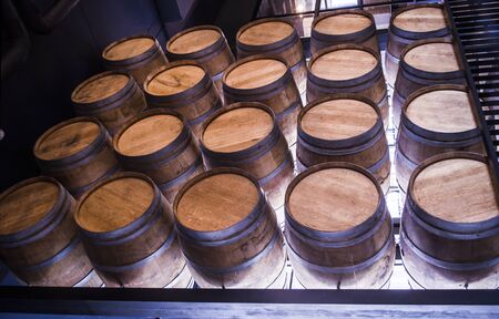 Wooden barrels with wine. Traditional wine storage photo.