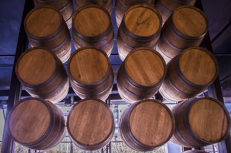Wooden barrels with wine. Traditional wine storage photo.