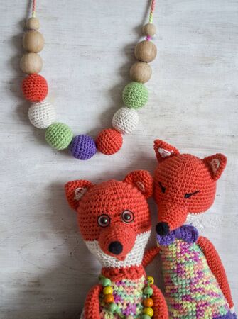 Knitted toy chanterelles. Couple in love. Animals crochet handmade.Sling necklace.の写真素材