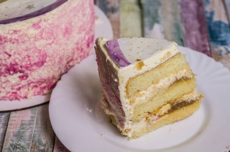 Piece of caramel cake with cream. Food dessert photo.の写真素材