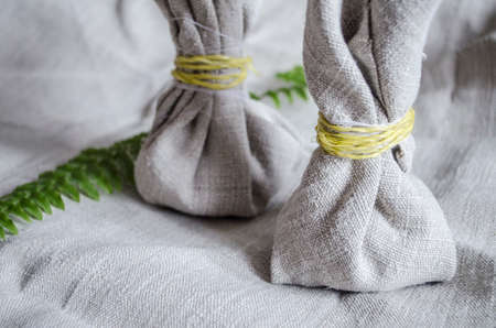 Herbal muscles for massage from linen home-woven cloth. medicine healing photo.の写真素材