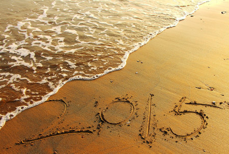 the year of 2015 written on the beach