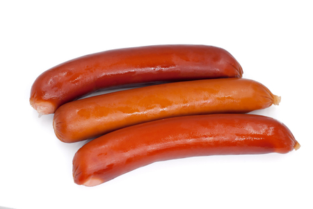 Stack of smoked sausages isolated on a white backgroundの写真素材
