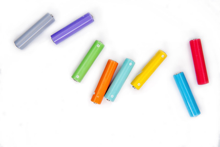 Several AA batteries in perspective closeup view on white backgroundの写真素材