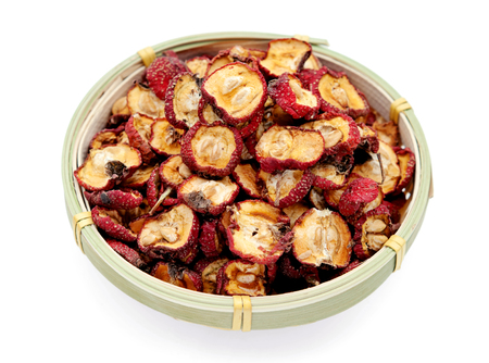 Dried hawthorn slices for brewing tea on white backgroundの写真素材