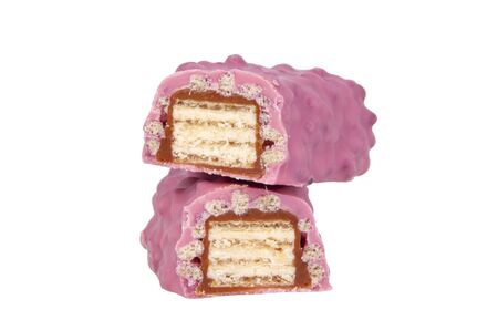Pink chocolate crispy brocken bar with wildberry taste isolated on the white