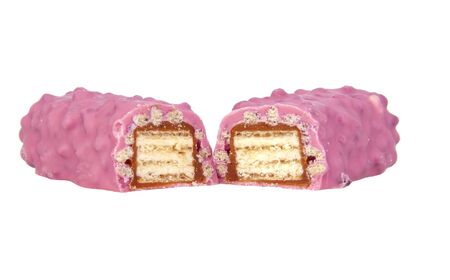 Pink chocolate crispy brocken bar with wildberry taste isolated on the white