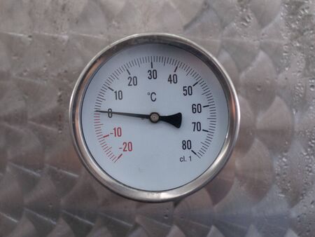 Circle thermometer measure on metal