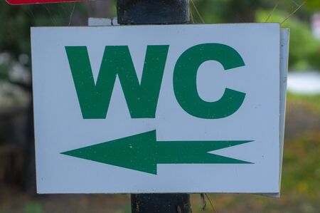 wc sign on the tree for information of the toilet photo