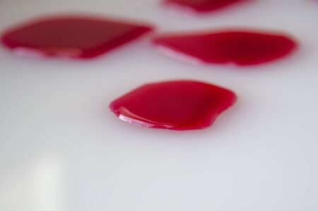 Red blood drops on the white