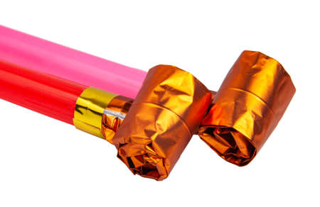 Party colorful foil noisemaker rolled or whistle isolated on the whiteの写真素材